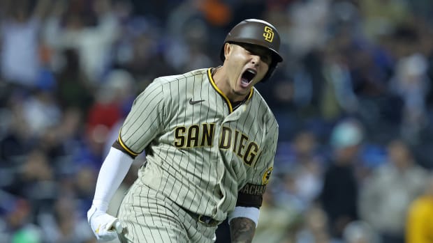 Manny Machado yells after hitting a home run.